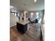 Open concept living space with island featuring hard surface countertops at 2383 S Troy Ct, Aurora, CO 80014
