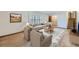 Living room with hardwood floors, neutral-toned furniture, and a cozy atmosphere at 12883 Columbine Cir, Thornton, CO 80241