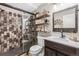 Modern bathroom features a stylish glass-enclosed shower, a sleek vanity, and contemporary accents at 25148 E Lake Pl, Aurora, CO 80016