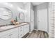 Bright bathroom features double sinks, ample storage, and modern fixtures, perfect for a functional and stylish space at 25148 E Lake Pl, Aurora, CO 80016