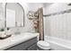 Stylish bathroom offers a shower-tub combination, sleek vanity, and contemporary accents, creating a spa-like retreat at 25148 E Lake Pl, Aurora, CO 80016