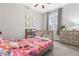 Cozy bedroom featuring whimsical decor, soft grey walls, and natural light, creating a -friendly atmosphere at 25148 E Lake Pl, Aurora, CO 80016