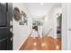 Inviting entryway featuring hardwood floors, neutral walls, and decorative accents at 25148 E Lake Pl, Aurora, CO 80016