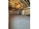 Unfinished basement awaiting customization with exposed ceiling and concrete flooring at 394 Grey Rock St, Brighton, CO 80601