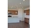 Contemporary kitchen with stainless steel appliances, a center island, and wooden cabinets at 394 Grey Rock St, Brighton, CO 80601