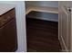 Corner pantry providing practical storage with shelves and easy access from the kitchen at 394 Grey Rock St, Brighton, CO 80601