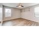 Bright bedroom with luxury vinyl plank flooring, natural light, and neutral paint at 14100 E Temple Dr # W01, Aurora, CO 80015