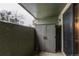 This patio features a storage closet and a secure screened door at 14100 E Temple Dr # W01, Aurora, CO 80015