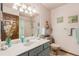 Bathroom with decorative touches, a large mirror, updated fixtures, and a separate toilet and shower area at 1095 Lake Woodmoor Dr, Monument, CO 80132