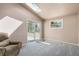 Bonus room with vaulted ceiling, skylight, and access to the backyard at 1095 Lake Woodmoor Dr, Monument, CO 80132