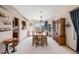 Elegant dining room with mountain views and a classic china cabinet at 1095 Lake Woodmoor Dr, Monument, CO 80132