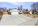 Charming home featuring a large garage, long driveway, and well-maintained exterior, set in a desirable neighborhood at 1640 Amherst Dr, Longmont, CO 80503