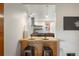 Modern kitchen with copper backsplash, stainless steel appliances, and breakfast bar at 2845 N Vine St, Denver, CO 80205