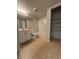 Bathroom with a shower-tub combination and ample shelving for storage and organization at 8555 Fairmount Dr # G103, Denver, CO 80247