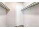 Walk-in closet with shelving and hanging rods for organized storage of clothing and accessories at 8555 Fairmount Dr # G103, Denver, CO 80247