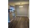 Cozy dining area adjacent to kitchen, featuring modern floors and natural lighting at 8555 Fairmount Dr # G103, Denver, CO 80247