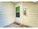 Welcoming front entry with a storm door, a visible fire extinguisher and a welcome mat at 8555 Fairmount Dr # G103, Denver, CO 80247
