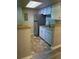 This kitchen features modern stainless steel appliances and ample counter space for cooking and food preparation at 8555 Fairmount Dr # G103, Denver, CO 80247