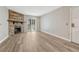 Stylish living room boasts a stone fireplace, sliding doors, and sleek, modern flooring at 8555 Fairmount Dr # G103, Denver, CO 80247