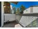 A private patio with lattice railing, perfect for relaxing outdoors at 8555 Fairmount Dr # G103, Denver, CO 80247
