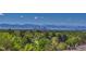 Scenic view of the city skyline and distant mountains from this beautiful property at 8555 Fairmount Dr # G103, Denver, CO 80247