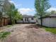 Exterior back of home featuring access to deck and detached garage at 449 King St, Denver, CO 80204