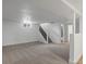 Spacious basement featuring neutral carpet, staircase, and white walls for a bright, open feel at 449 King St, Denver, CO 80204