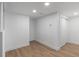 Finished basement with modern recessed lighting and beautiful wood-look floors for a warm feel at 449 King St, Denver, CO 80204