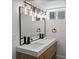 Bathroom with stylish lighting, double sink, and a modern design at 449 King St, Denver, CO 80204