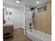 Well-lit bathroom features modern tile, double sink, and shower at 449 King St, Denver, CO 80204