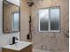 Bathroom boasting a vanity with matte black hardware, mirror, and shower fixtures at 449 King St, Denver, CO 80204