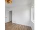 Light-filled bedroom featuring wood flooring, a ceiling fan, and light fixture at 449 King St, Denver, CO 80204