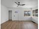 Light-filled entryway with vinyl floors, front door, and a view of the surrounding neighborhood at 449 King St, Denver, CO 80204