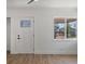 Inviting entryway features a window, vinyl floors, and a stylish front door at 449 King St, Denver, CO 80204