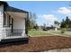 Attractive exterior with a focus on the newly landscaped front yard and neighborhood views at 449 King St, Denver, CO 80204
