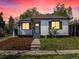 Charming home with a well-manicured lawn, fresh mulch, and sidewalk leading up to the front door at 449 King St, Denver, CO 80204