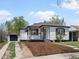 Charming single-story home with freshly landscaped front yard and detached garage at 449 King St, Denver, CO 80204