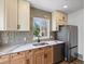 Modern kitchen offers sleek stainless steel appliances, ample counter space and contemporary finishes at 449 King St, Denver, CO 80204