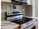 Gleaming, modern kitchen showcasing stainless steel appliances and stone countertops at 449 King St, Denver, CO 80204