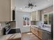 Bright kitchen featuring stainless appliances, bright cabinets, stylish backsplash, and modern countertops at 449 King St, Denver, CO 80204