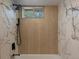 Shower boasts sleek, modern fixtures and stunning tile design at 449 King St, Denver, CO 80204