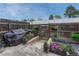 This patio features a grill, raised garden beds, and a wood fence at 14034 E Utah Cir, Aurora, CO 80012