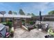 This backyard features a patio, raised garden beds, and a wood fence at 14034 E Utah Cir, Aurora, CO 80012