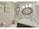 Cozy bathroom with a stylish vessel sink and decorative wall art at 14034 E Utah Cir, Aurora, CO 80012