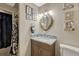 This bathroom features a unique vanity mirror, and seashell accents at 14034 E Utah Cir, Aurora, CO 80012