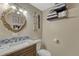 This bathroom features a marble countertop, decorative seashells, and a blue glass backsplash at 14034 E Utah Cir, Aurora, CO 80012