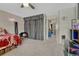 A cozy bedroom with gray carpet, decor and a neon sign on the wall at 14034 E Utah Cir, Aurora, CO 80012