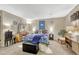 Bedroom featuring a large bed, mirrored vanity, and decor on the walls, creating a comfortable space at 14034 E Utah Cir, Aurora, CO 80012