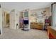 Bedroom featuring neutral walls, gray carpet, and eclectic decor, giving a cozy vibe at 14034 E Utah Cir, Aurora, CO 80012