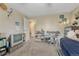 Bedroom featuring a twin bed, TV on a stand, and access to another room through a doorway at 14034 E Utah Cir, Aurora, CO 80012
